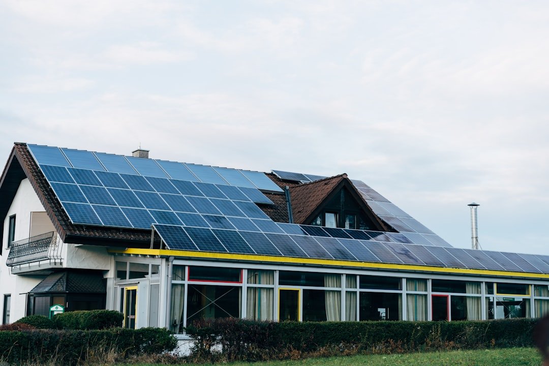 a-house-with-solar-panels-on-the-roof-vx0zezswqny